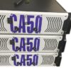 Three stacked Ejimek Japan CA50 professional power amplifiers with white front panels and large blue "CA50" lettering. Each amplifier has two black control knobs and a power switch on the left side. The units have black handles on the sides and ventilation patterns on the front panels.