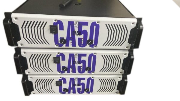 Three stacked Ejimek Japan CA50 professional power amplifiers with white front panels and large blue "CA50" lettering. Each amplifier has two black control knobs and a power switch on the left side. The units have black handles on the sides and ventilation patterns on the front panels.