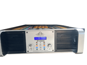 Front view of an Ejimek Japan P14000 professional power amplifier with a silver faceplate. It features two control knobs labeled CH A and CH B, an LED display showing channel levels and temperatures, and indicator lights for clip, signal, protect, power, and bridge. Ventilation grilles and a power switch are also visible.