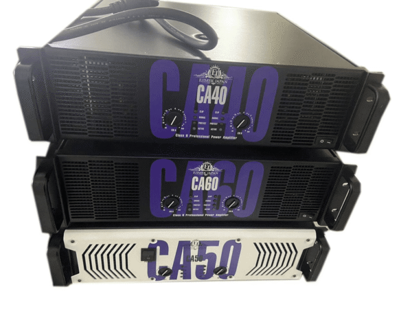 Three professional power amplifiers stacked vertically. The top amplifier is labeled CA40 with black casing and purple text, the middle one is labeled CA60 with similar design, and the bottom amplifier is labeled CA50 with a white casing and purple text. Each amplifier has two control knobs for channels A and B, LED indicators for clip, signal, protect, and active, and power switches on the front panels. The amplifiers are branded Ejimek Japan.