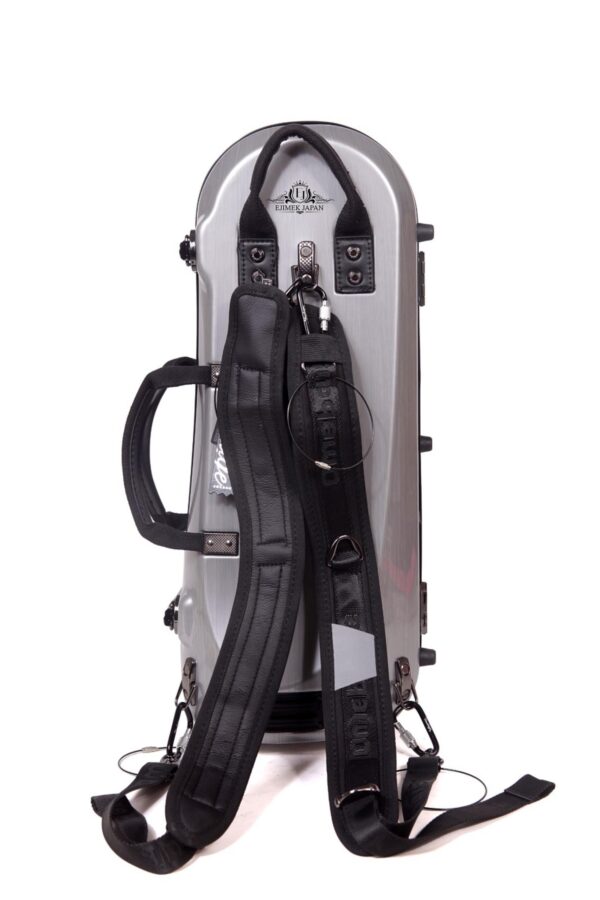 A silver hard-shell instrument case standing vertically with two black padded carrying straps attached. The straps have metal clasps and rings, and the case features a handle on the side. The logo "Ejimek Japan" is visible on the top part of the case.