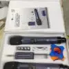 A professional UHF wireless microphone kit in a white box, featuring two DN-W1500PRO handheld microphones, a wireless receiver with a 6.35mm plug, four AA batteries, a charging cable, an anti-roll ring, and a user manual. The microphones are labeled with “ETIMEK JAPAN” branding and securely placed in foam packaging.