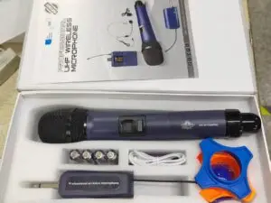 A professional UHF wireless microphone kit in a white box, featuring two DN-W1500PRO handheld microphones, a wireless receiver with a 6.35mm plug, four AA batteries, a charging cable, an anti-roll ring, and a user manual. The microphones are labeled with “ETIMEK JAPAN” branding and securely placed in foam packaging.