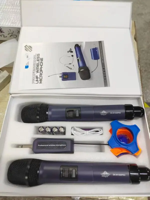 A professional UHF wireless microphone kit in a white box, featuring two DN-W1500PRO handheld microphones, a wireless receiver with a 6.35mm plug, four AA batteries, a charging cable, an anti-roll ring, and a user manual. The microphones are labeled with “ETIMEK JAPAN” branding and securely placed in foam packaging.